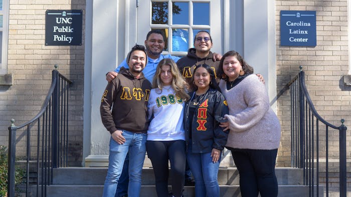 Josmell Pérez, director of the Carolina Latinx Center, poses for a portrait with members of the Latinx Center's Student Leadership Alliance on Monday, Feb. 28, 2022.