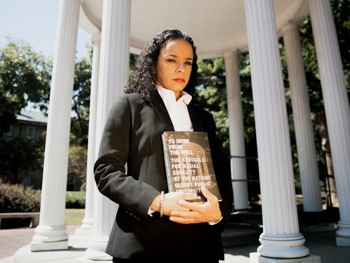 "It's been that way since the very beginning," says Geeta Kapur of the systemic racism at UNC. Kapur poses for a portrait at the Old Well with her new book, “To Drink from the Well: The Struggle for Racial Equality at the Nation’s Oldest University," on Tuesday, Sep 7., 2021.