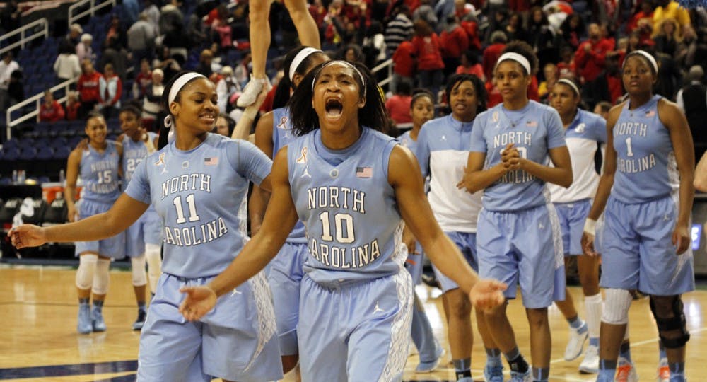 	UNC guard Danielle Butts (10) leads the celebration after UNC defeated Maryland 73-70 Friday night in Greensboro at the ACC Women&#8217;s Tournament.