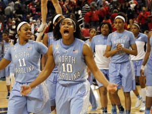 	UNC guard Danielle Butts (10) leads the celebration after UNC defeated Maryland 73-70 Friday night in Greensboro at the ACC Women&#8217;s Tournament.