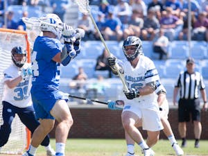 UNC fifth-year defender Sean Morris (16) attempts to block a Duke player during a home game at Dorrance Field on Saturday Apr. 2, 2022.