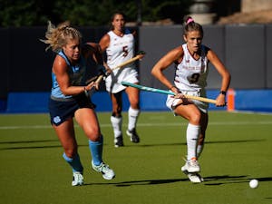 UNC sophomore midfielder/fullback Katie Dixon (14) fights for the ball in the Sept. 24 match against Boston College. UNC won 6-1.