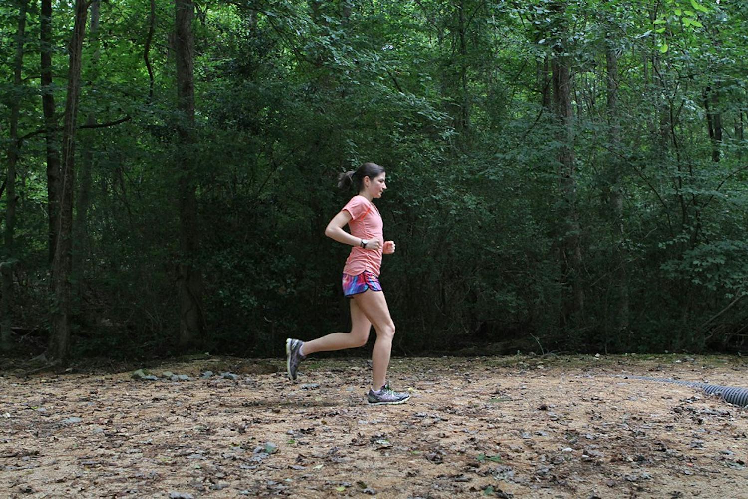 Mariana Lucena runs at the UNC Cross Country Course at Finley Fields.