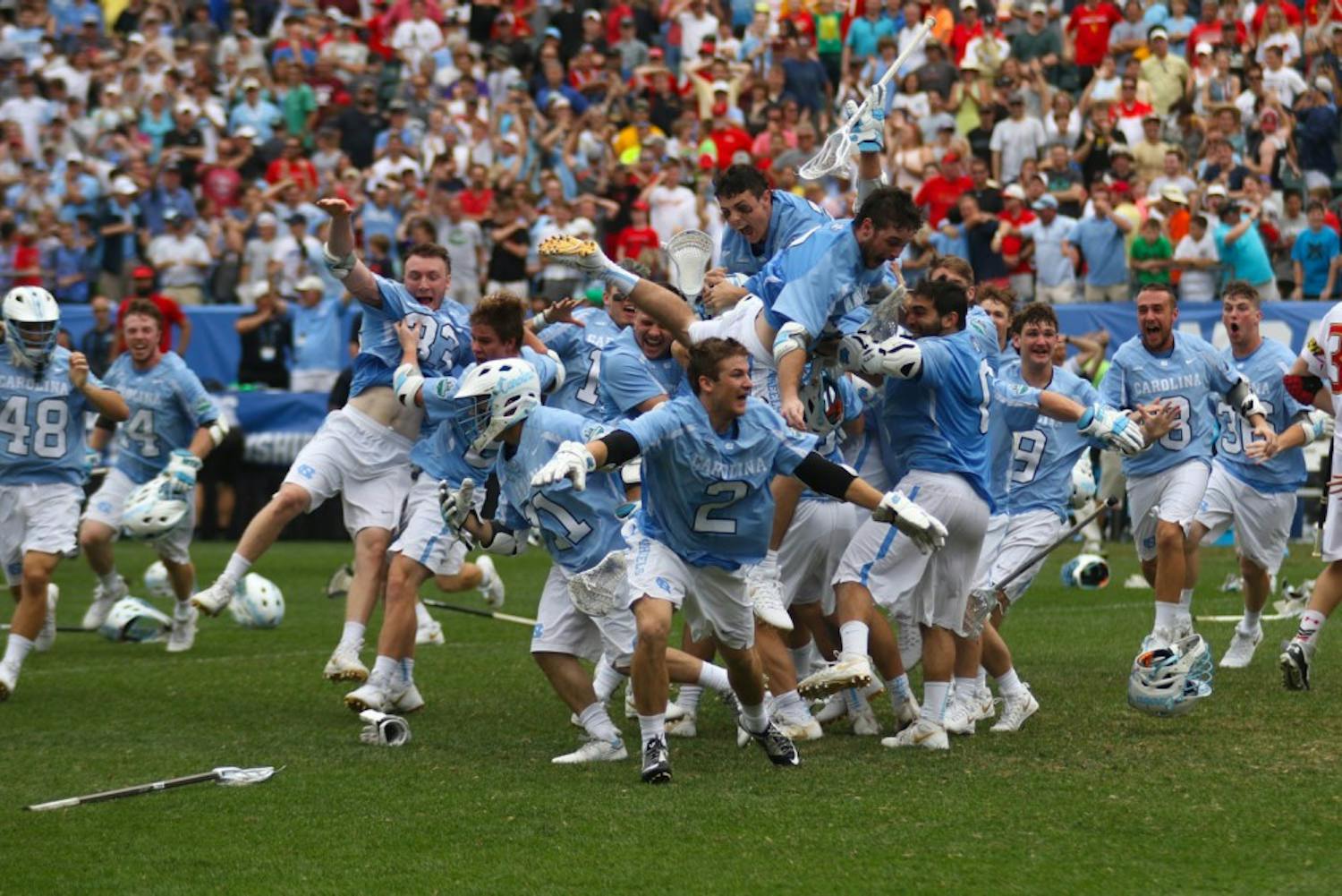 The North Carolina men's lacrosse team celebrates after defeating Maryland 14-13 in overtime to capture the program's first national championship since 1993 on Monday at Lincoln Financial Field in Philadelphia.