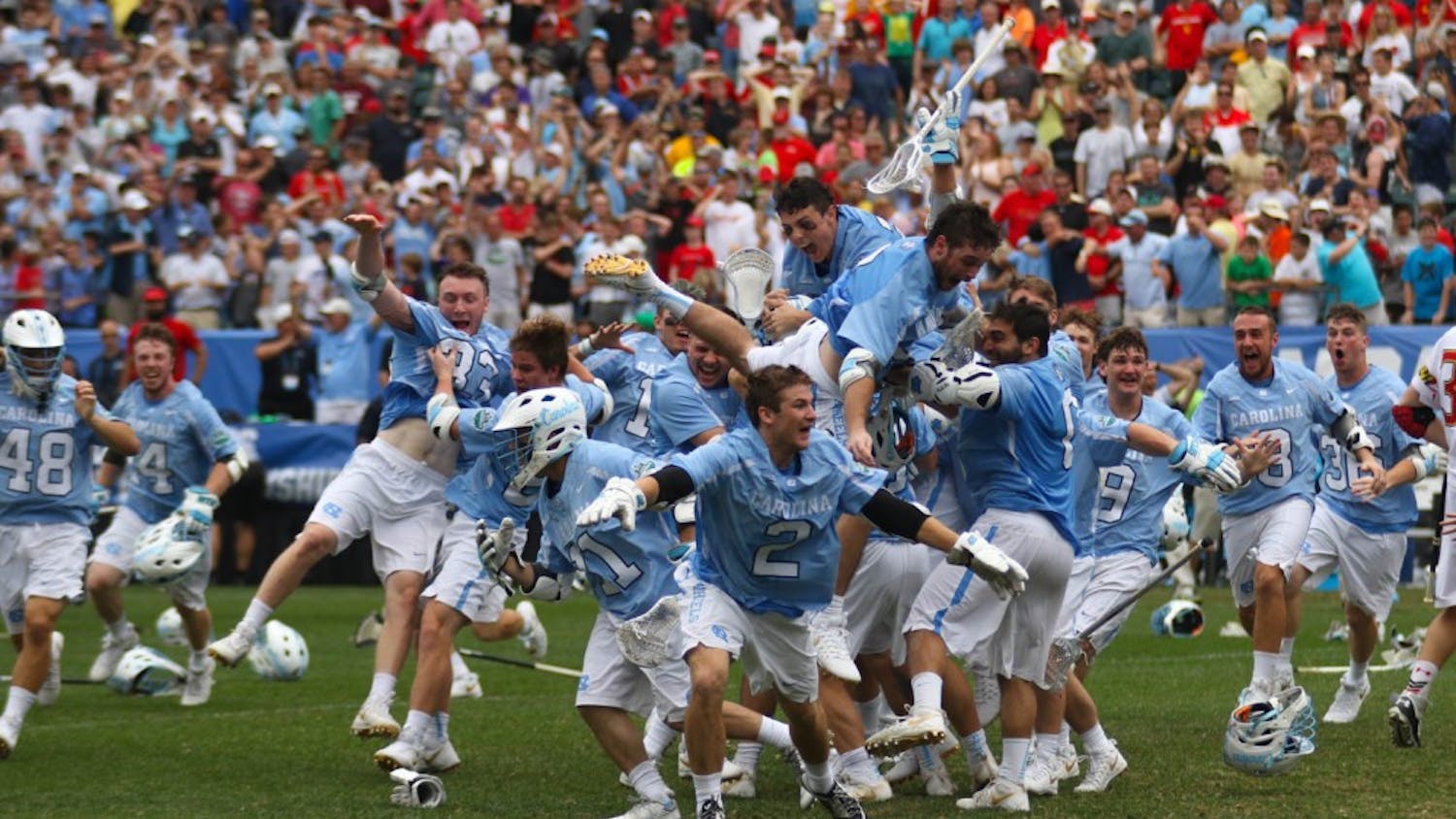 The North Carolina men's lacrosse team celebrates after defeating Maryland 14-13 in overtime to capture the program's first national championship since 1993 on Monday at Lincoln Financial Field in Philadelphia.