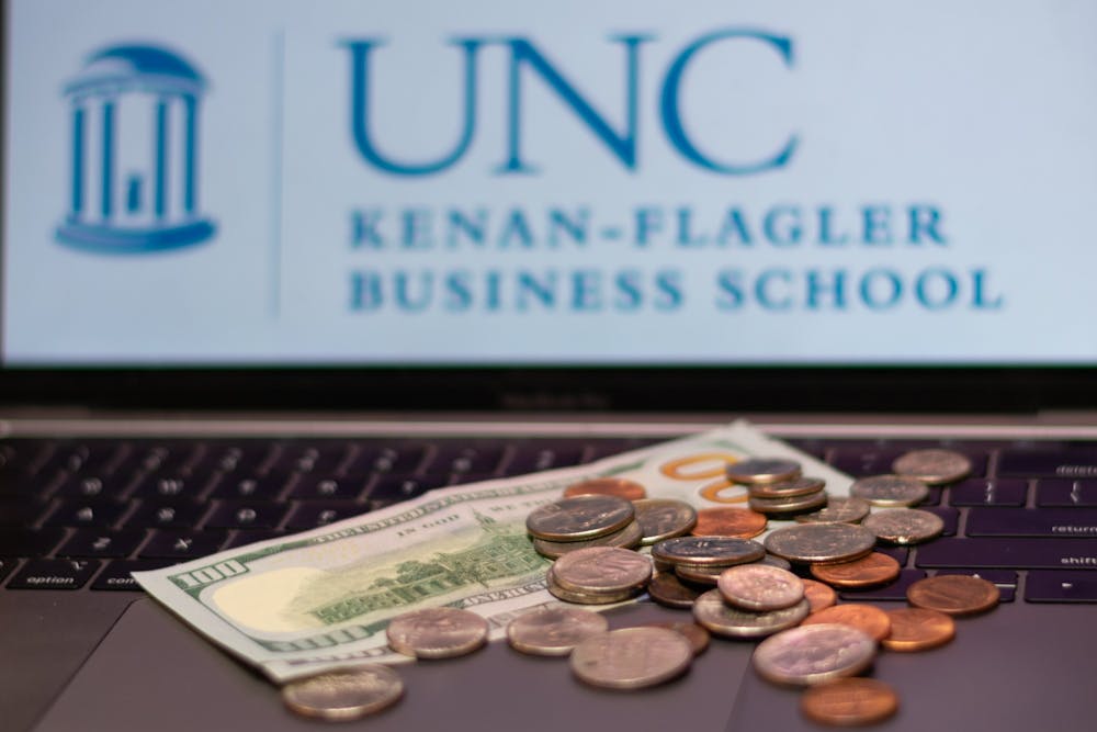 DTH Photo Illustration. The Kenan-Flagler Business School has raised its fees. 