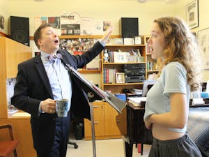 Professor Timothy Sparks sings with a student in 2015. Photo courtesy of Kelly Archer.