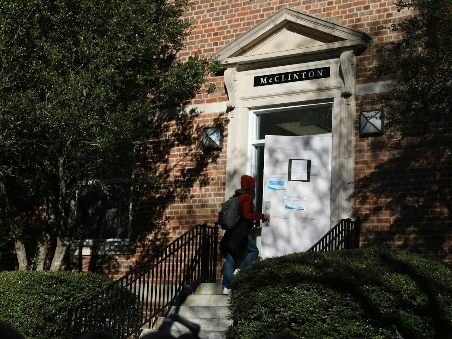 A student walks into McClinton Residence Hall on Tuesday, Jan. 11, 2022. Residence Hall One, formerly the Charles B. Aycock Residence Hall, was recently renamed after Hortense McClinton, the first Black faculty member at the University, on Friday, Dec. 3, 2021.