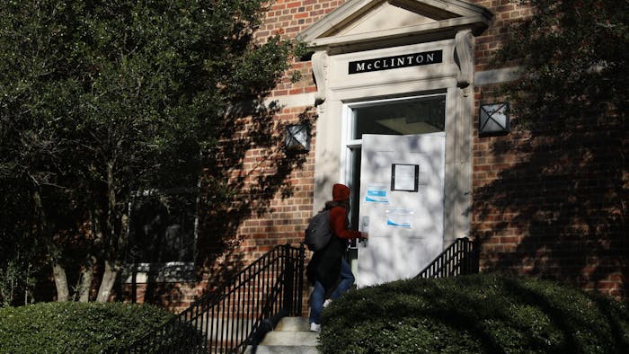 A student walks into McClinton Residence Hall on Tuesday, Jan. 11, 2022. Residence Hall One, formerly the Charles B. Aycock Residence Hall, was recently renamed after Hortense McClinton, the first Black faculty member at the University, on Friday, Dec. 3, 2021.