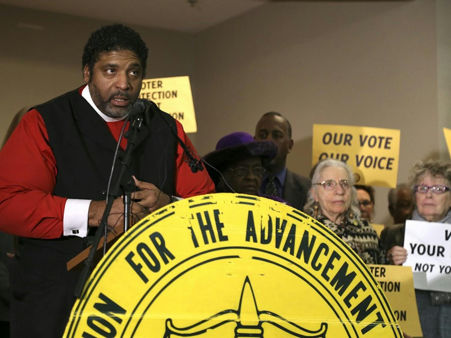 NAACP board member Rev. Dr. William Barber addresses the press at the conference in Martin Street Baptist Church in Raleigh on Tuesday. NC NAACP and Democracy NC joined with faith leaders to discuss a mass voter engagement campaign.