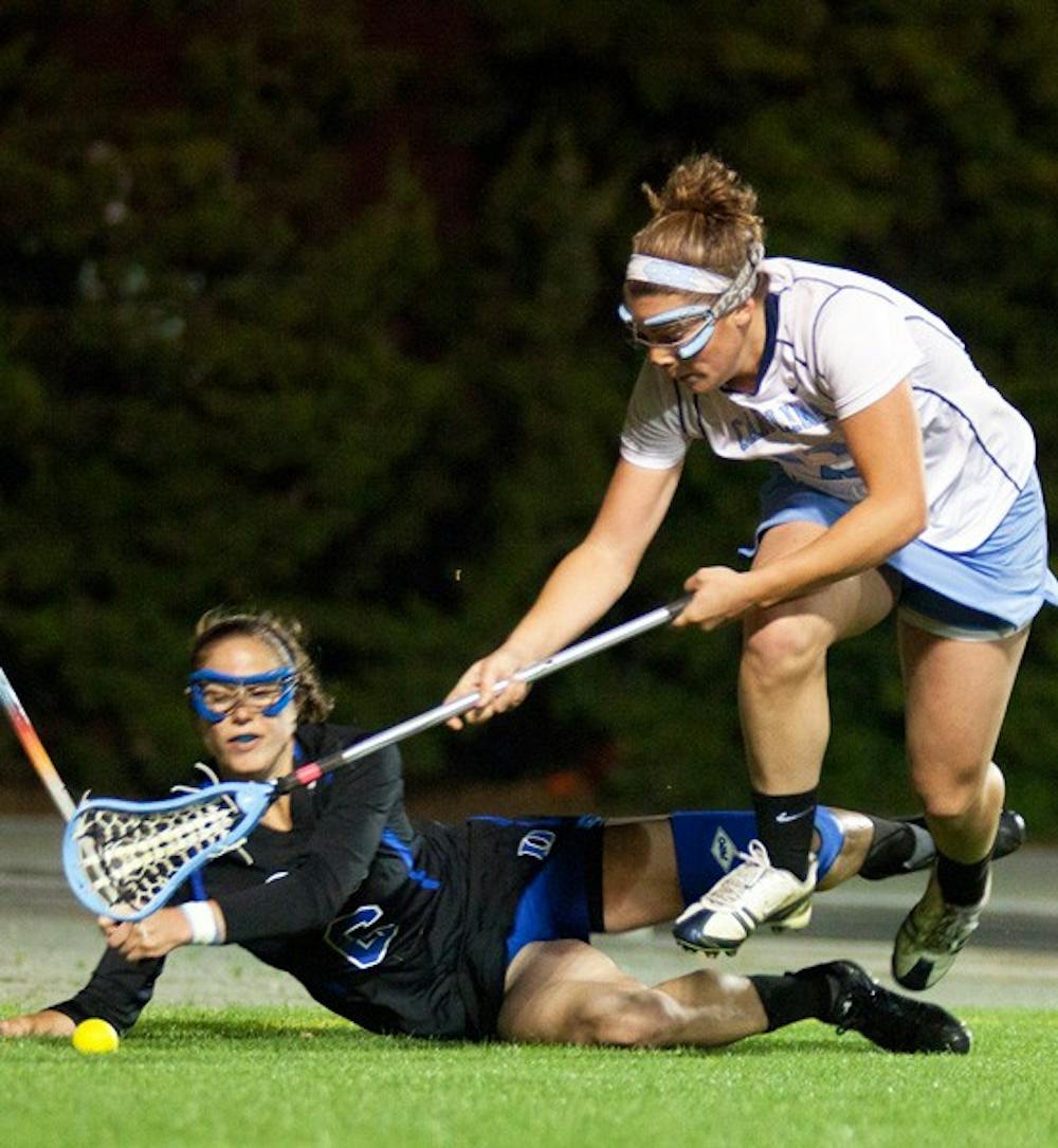 Sophomore attacker Becky Lynch fights for a ground ball Wednesday night during North Carolina’s 9-6 victory. DTH/Phong dinh