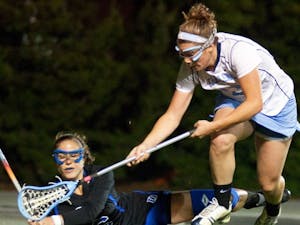 Sophomore attacker Becky Lynch fights for a ground ball Wednesday night during North Carolina’s 9-6 victory. DTH/Phong dinh