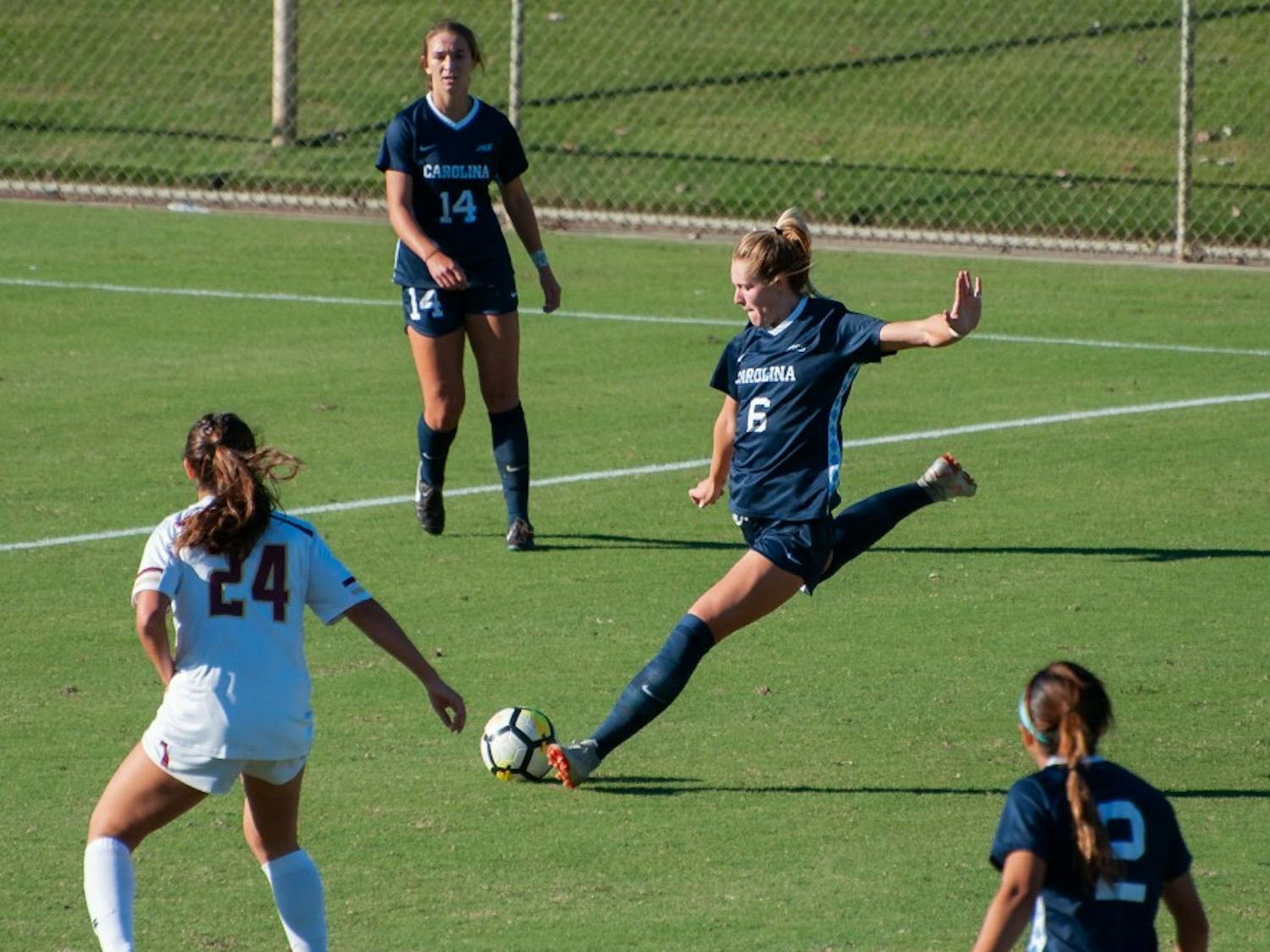 Forward (6) Taylor Otto clears the ball during Thursday's game against Boston College at WakeMed Soccer Park. 