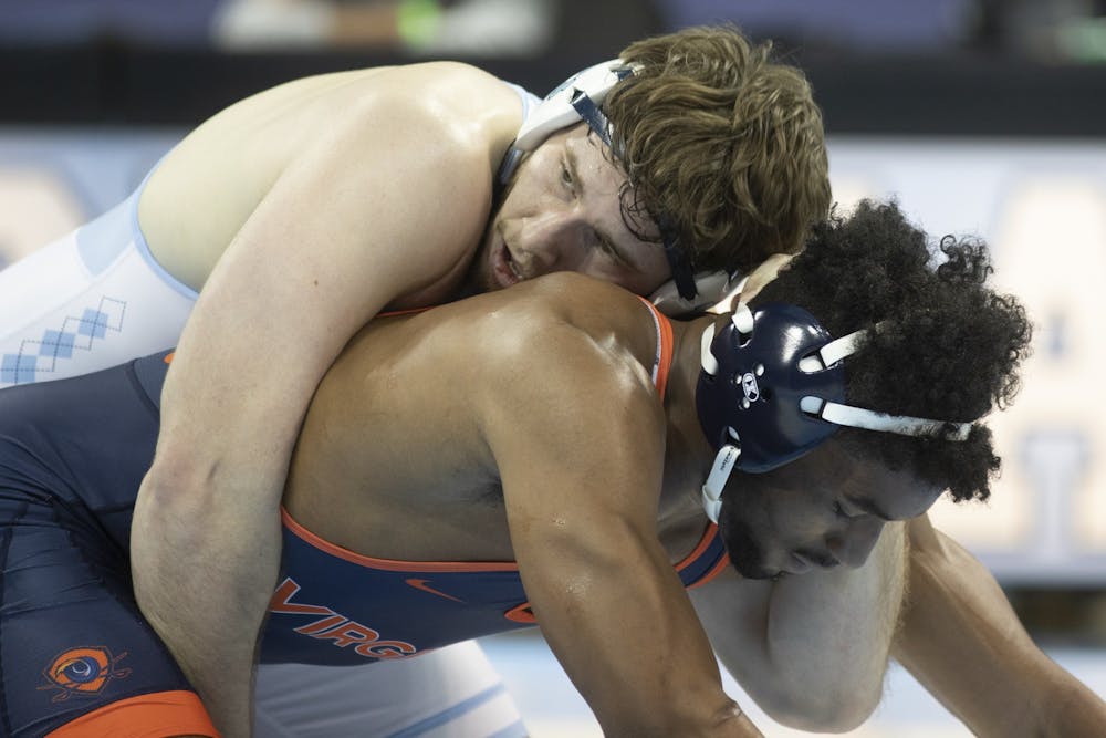 Andrew Gunning wrestles against UVA's Ethan Weatherspoon in the 285 lbs weight division in Carmichael Arena on Feb. 13, 2021. Gunning won his match and UNC won overall, 25-9.