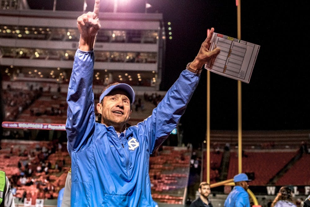 Coach Larry Fedora thanks fans at the end of both the Tar Heels' historic regular season and decisive 45-34 victory over N.C. State on Sunday.