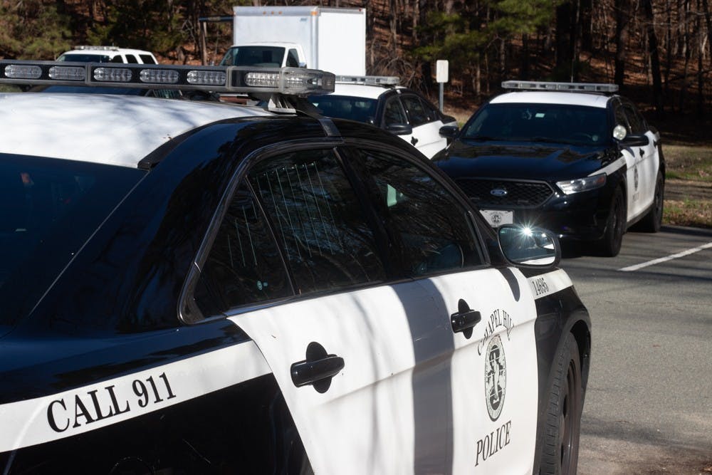 Chapel HIll Police vehicles standby at the Chapel Hill Police Department on Tuesday, Jan. 28, 2020. The Chapel Hill Police Department has increased their patrols in and around UNC's Campus in response to the sexual assault in the Shortbread Lofts parking deck.