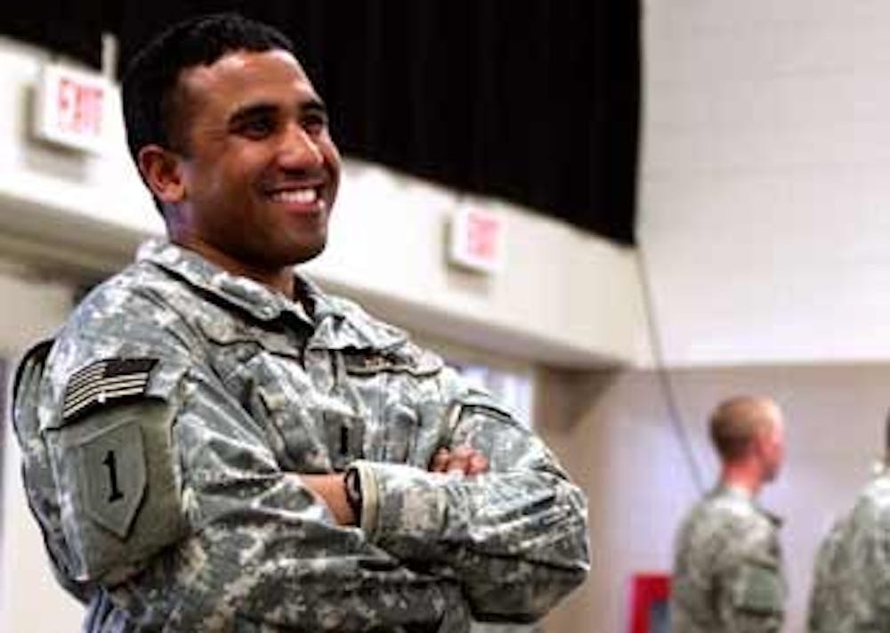 Emran Huda" a 2006 alumnus smiles at a send-off for him and other North Carolina medics in Fayetteville at the Cumberland County Coliseum on Tuesday afternoon among a crowd of more than 4000 soldiers. Huda will soon be deployed with the 30th Brigade to Iraq. 