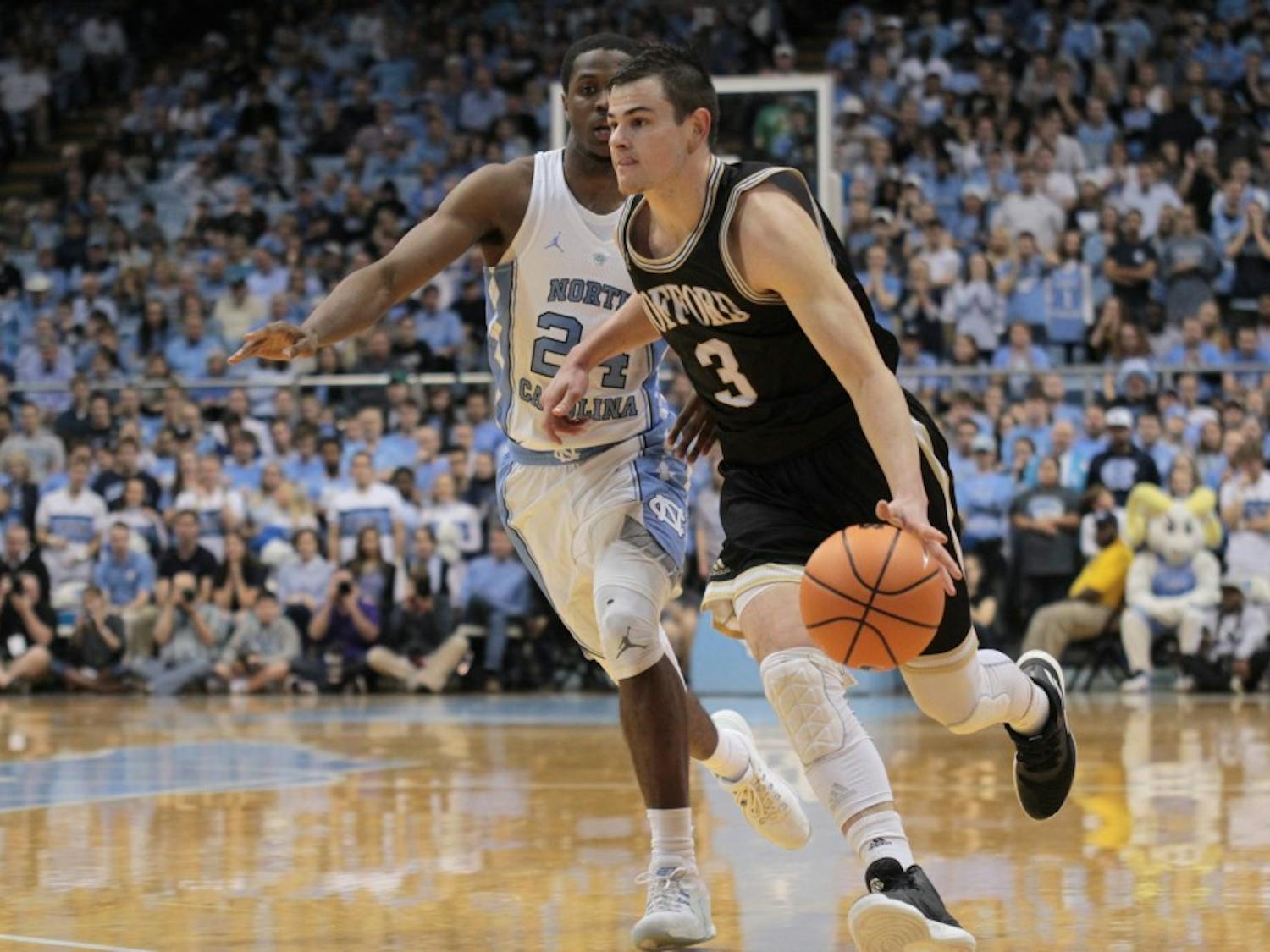 Wofford guard Fletcher Magee (3) drives past North Carolina guard Kenny Williams (24) on Dec. 20 in the Smith Center.