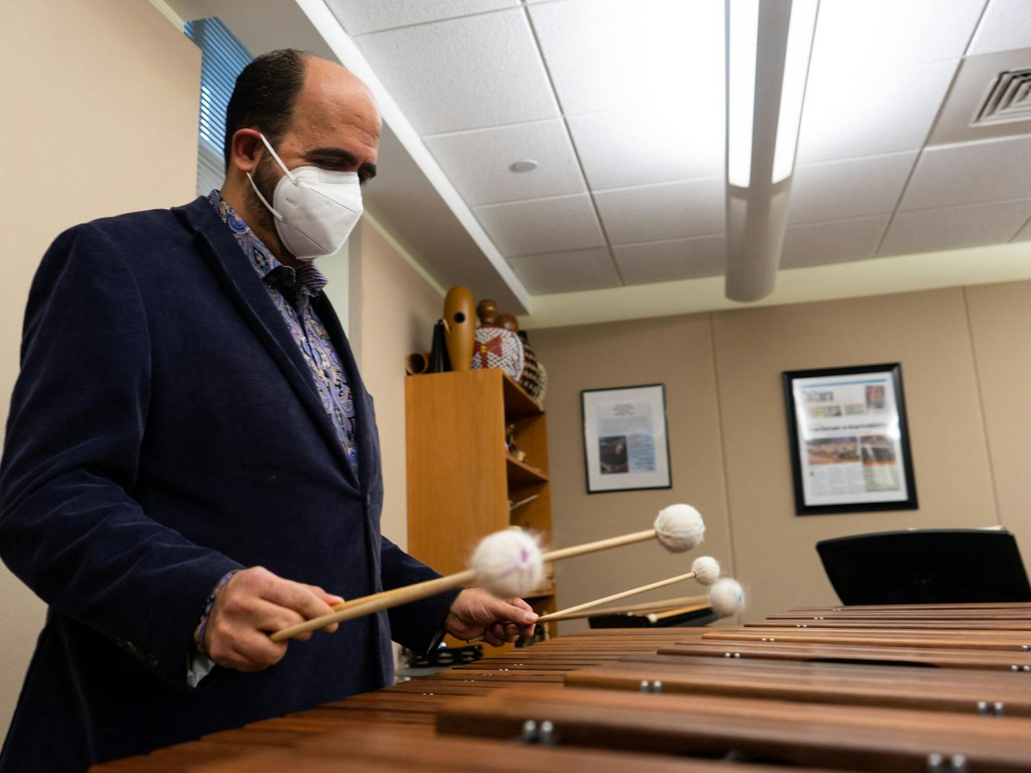 Professor Juan Álamo plays the xylophone in the Kenan Music Building on Jan. 20, 2022. Álamo has been appointed as a distinguished term associate professor in the department of music.