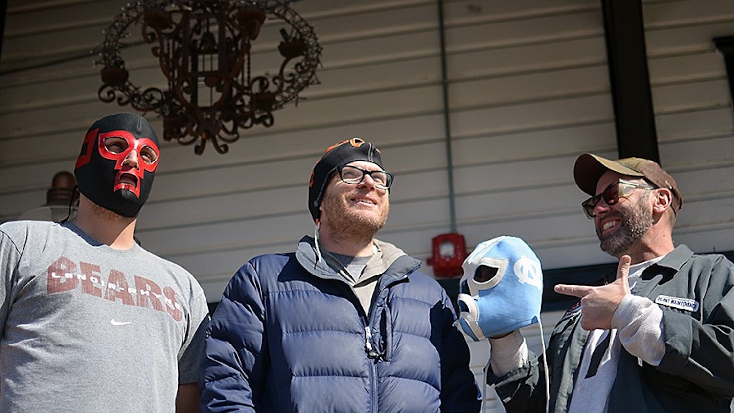  Alex Freeman (left), Chip Hoppin (middle), Mike Benson (right), and Mike Tyrrell (not pictured), own a mask making business in Carrboro. They have been making masks for ten years. 
