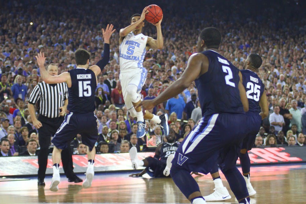 Marcus Paige (5) makes a three-point shot in the last five seconds of the National Championship game, which tied the score 74-74.