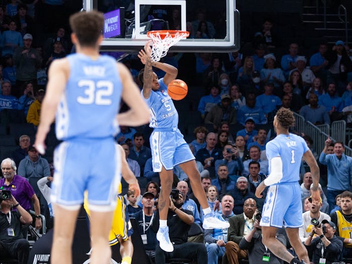 UNC senior forward/center Armando Bacot (5) dunks the ball during the men's basketball game against Michigan at the Jumpman Invitational in Charlotte, N.C., on Wednesday, Dec. 21, 2022. UNC beat Michigan 80-76.