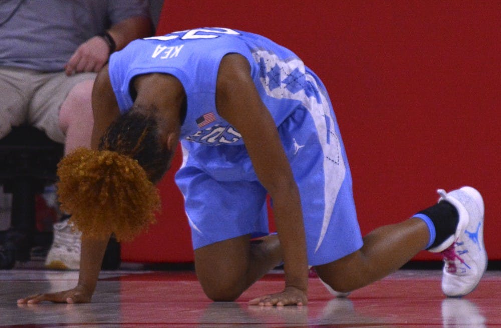 North Carolina guard Paris Kea (22) struggles to get up after taking a&nbsp;hard fall&nbsp;after a missed layup attempt against N.C. State Thursday night.