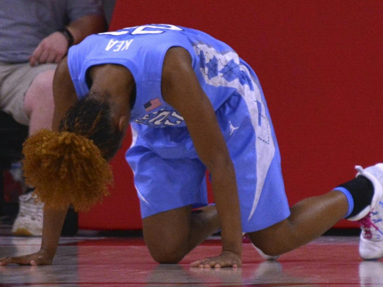 North Carolina guard Paris Kea (22) struggles to get up after taking a&nbsp;hard fall&nbsp;after a missed layup attempt against N.C. State Thursday night.
