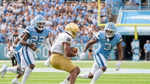 Junior defensive back, Storm Duck (3), and sophomore linebacker, Power Echols (23), go in for the tackle in Kenen Stadium on Sept. 24, 2022, at the UNC game against Notre Dame. UNC lost 45-32. 