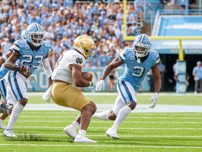Junior defensive back, Storm Duck (3), and sophomore linebacker, Power Echols (23), go in for the tackle in Kenen Stadium on Sept. 24, 2022, at the UNC game against Notre Dame. UNC lost 45-32. 