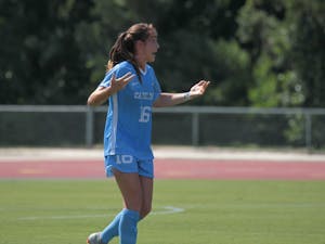 Senior defender Julia Ashley throws her hands in the hair during UNC's 3-2 exhibition win over N.C. State on Aug. 9 in Raleigh.