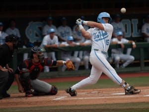 UNC baseball junior and 1B, Michael Busch (15), swings and misses the ball during the first game of the super regionals versus Auburn on Saturday June 8, 2019. Auburn beat UNC 11-7.