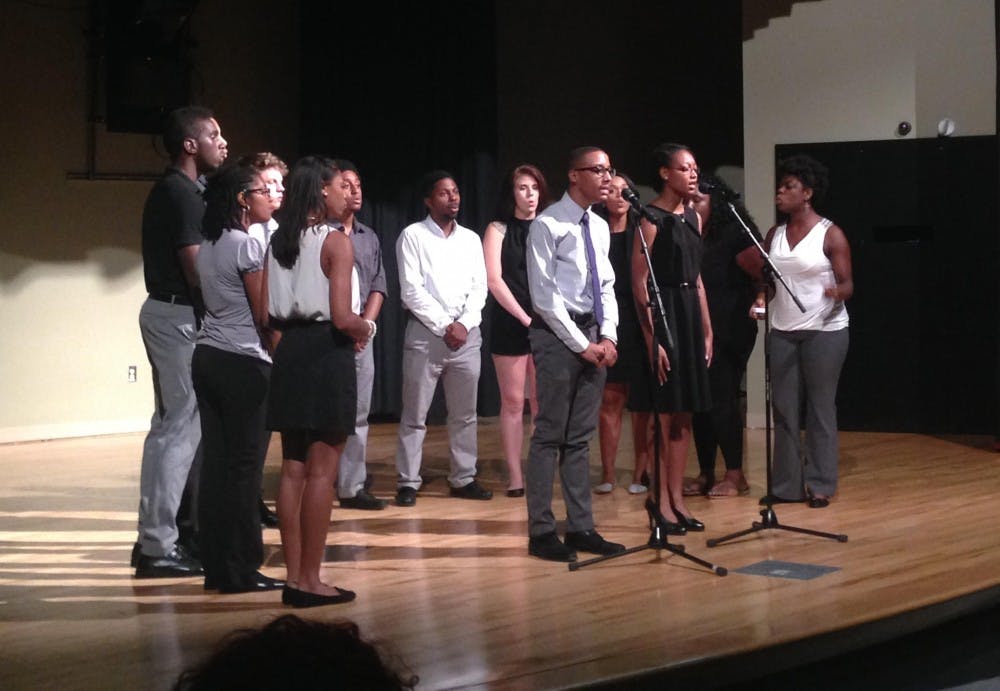 <p>The Harmonyx, a sub group of the Black Student Movement, performs as a part of a BSM meeting.</p>