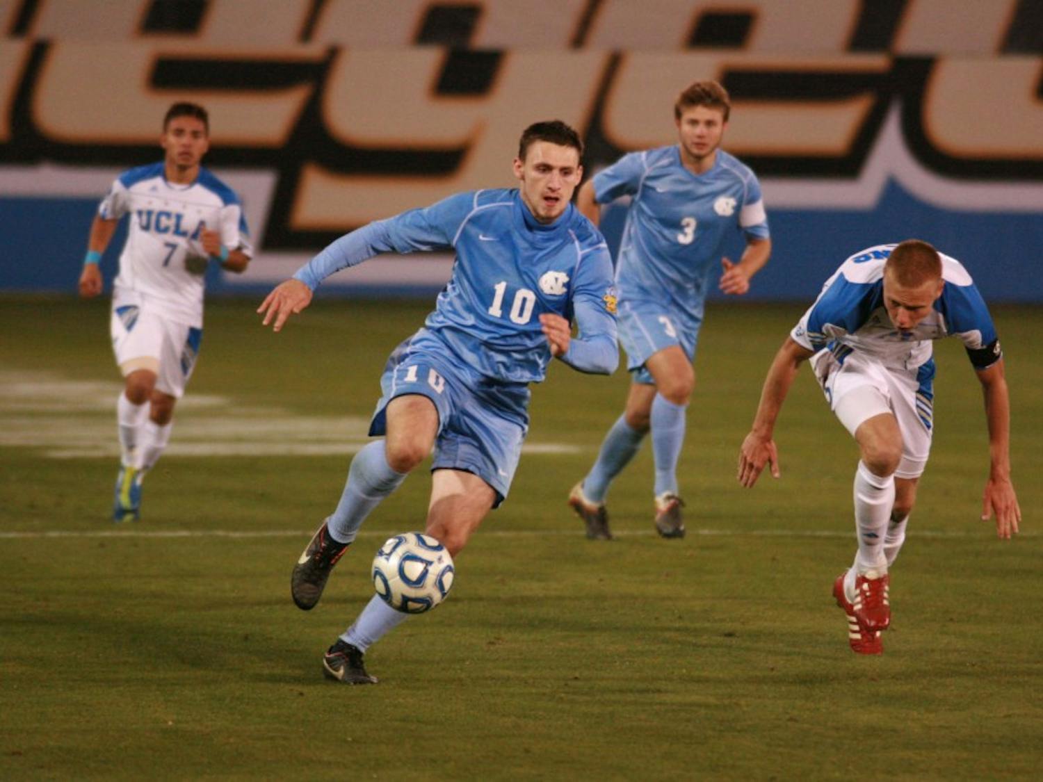	Junior forward Billy Schuler chases down the ball in Friday&#8217;s national semifinal.