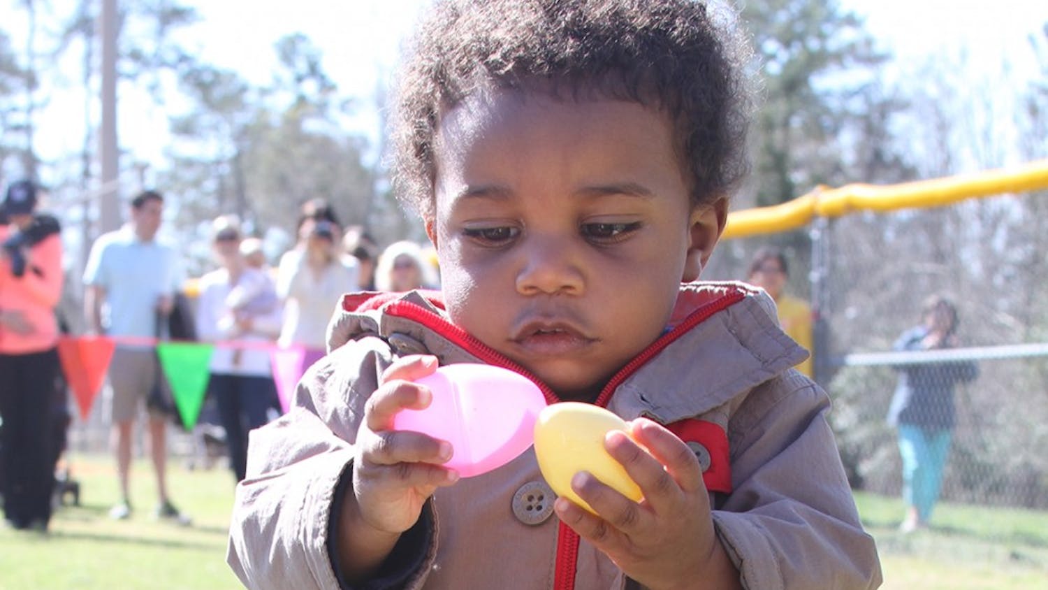 Kids participate in an egg hunt at Homestead Park in Chapel Hill on April 5.