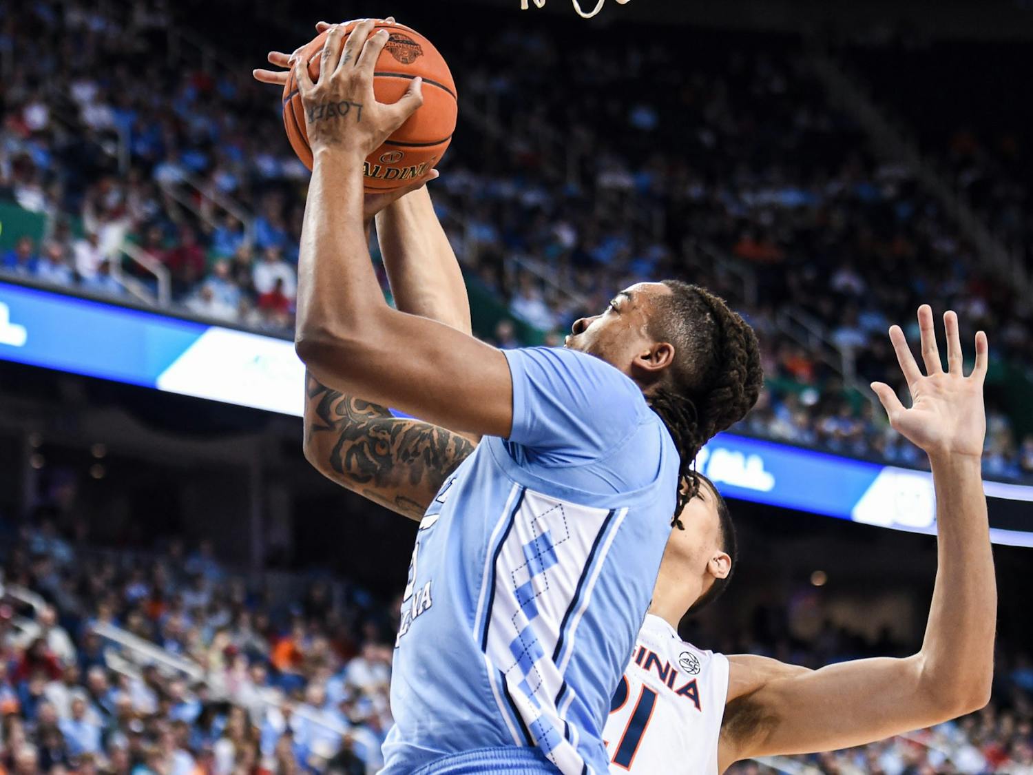 UNC senior forward and center Armando Bacot (5) attempts to score a basket during the game against Virginia in the ACC Tournament Quarterfinals at Greensboro Coliseum on March 9, 2023. UNC fell to Virginia 68-59.