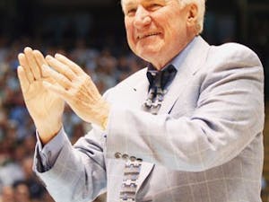Former UNC coach Dean Smith was honored as a member of the basketball Hall of Fame at halftime of Saturday?s game against Virginia" along with UNC greats Billy Cunningham Robert McAdoo and James Worthy.