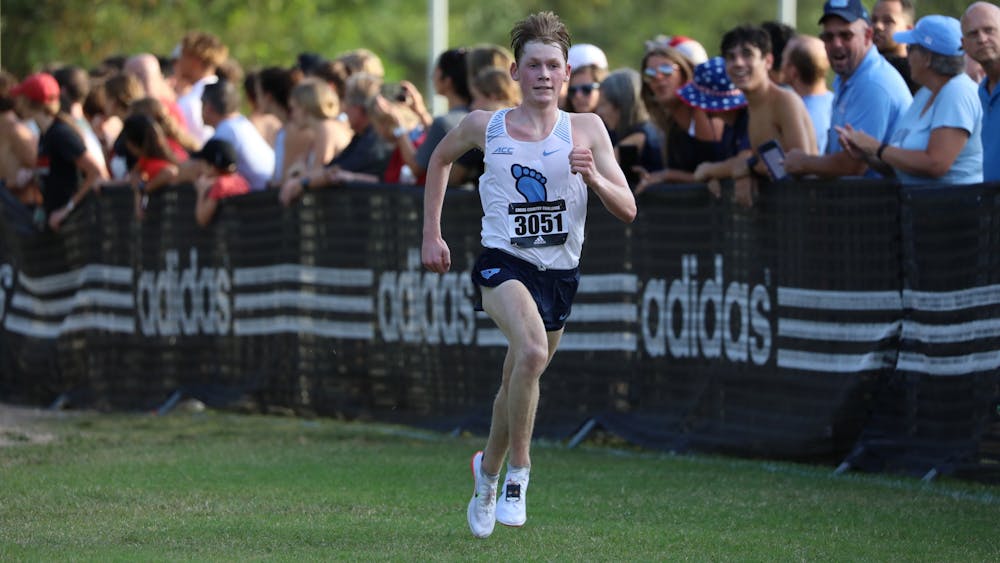 <p>Then first-year Parker Wolfe finishes first overall in a 6000-meter race, running a 17:48.0 Sept. 26, 2021 at North Carolina State University. <br>
Photo Courtesy of NC State Athletics.</p>