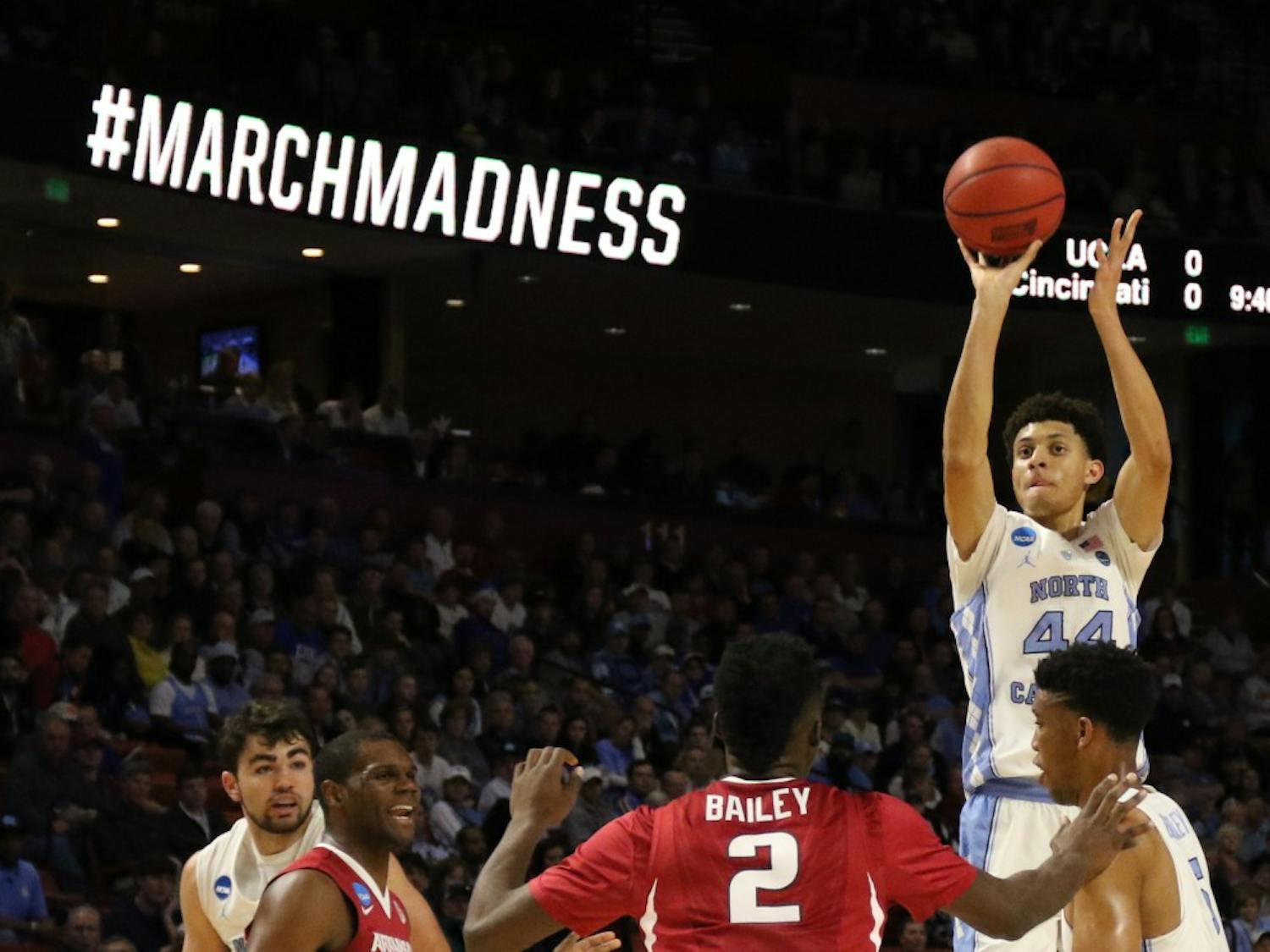 The North Carolina men's basketball team escaped a near upset by Arkansas, edging the Razorbacks 72-65 in the second round of the NCAA Tournament in Greenville on Sunday. The Tar Heels will play Butler on Friday in the Sweet 16 in Memphis.