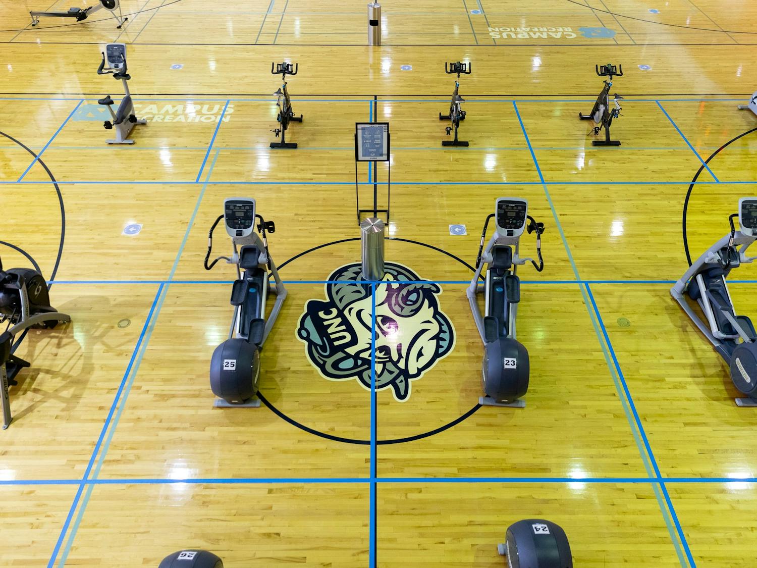 Cardio machines lie on the basketball courts in Ram’s Head gym on UNC’s campus on Feb. 6, 2021.