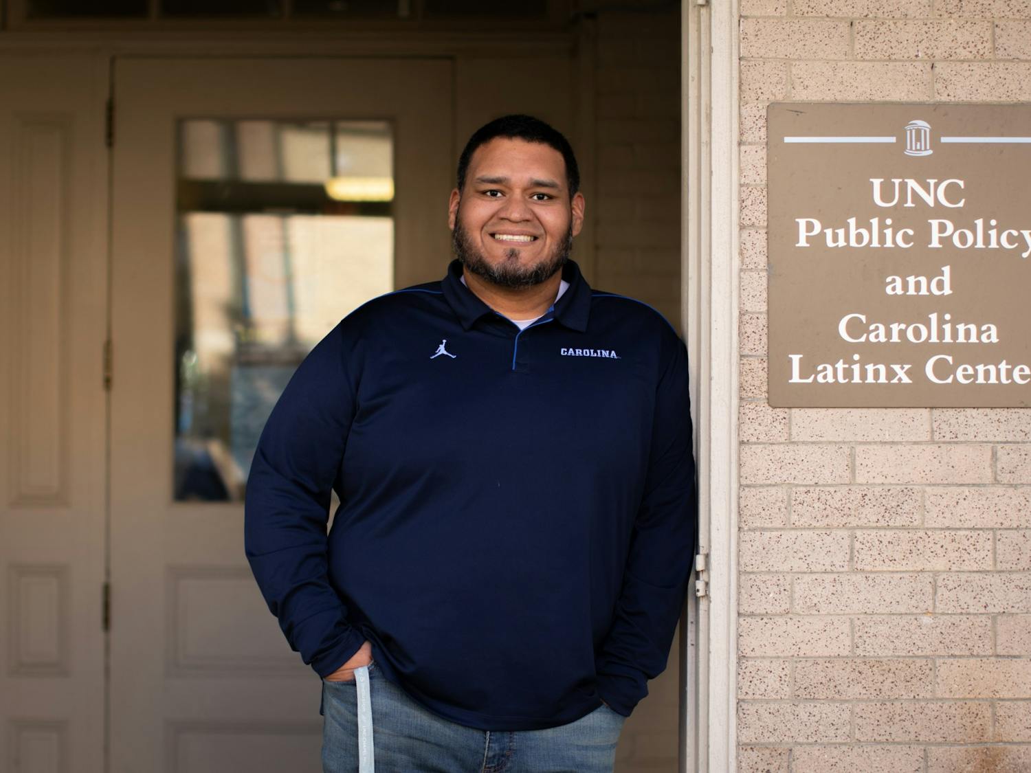 Josmell Perez, director of the Carolina Latinx Center, one of four cultural centers that make up the UNC Alliance, poses for a portrait outside the CLC on Monday, Jan. 31, 2022.&nbsp;