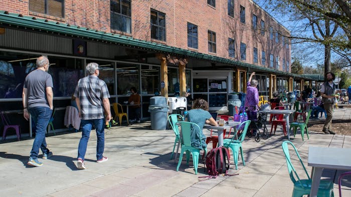 Carrboro and Chapel Hill residents enjoy a nice day at Weaver Street Market on Tuesday, March 7, 2023.