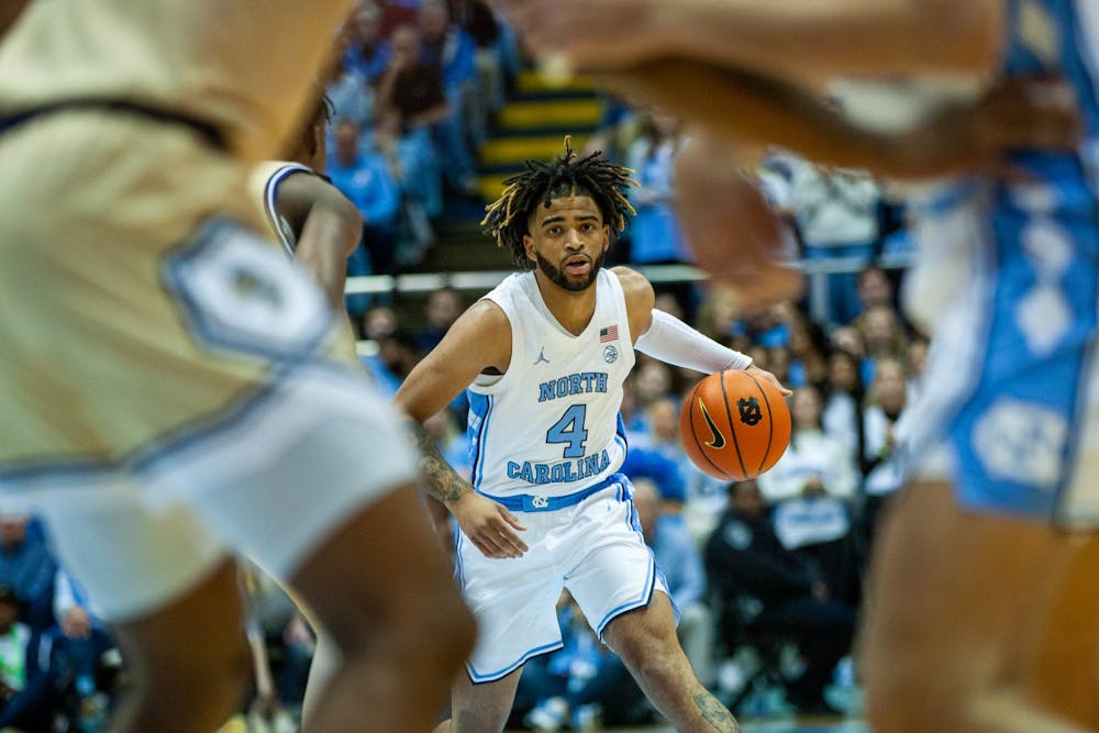UNC junior guard RJ Davis (4) steadily watching his opponent while he dribbles the ball during the men's basketball game against Georgia Tech in the Dean Smith Center on Saturday, Dec. 10, 2022. UNC beat Georgia Tech 75-59.