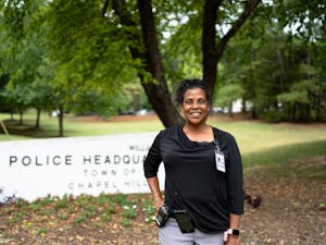 Laverne Burton, city crisis unit counselor, poses for a portrait in front of the Chapel Hill Police Department on Thursday, July 7, 2022.