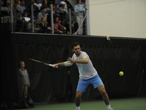 Junior William Blumberg, undeclared major, playing for the UNC men's tennis team against Duke on Jan. 26, 2019, in the Cone-Kenfield Tennis Center. UNC won 4-1 against Duke.
