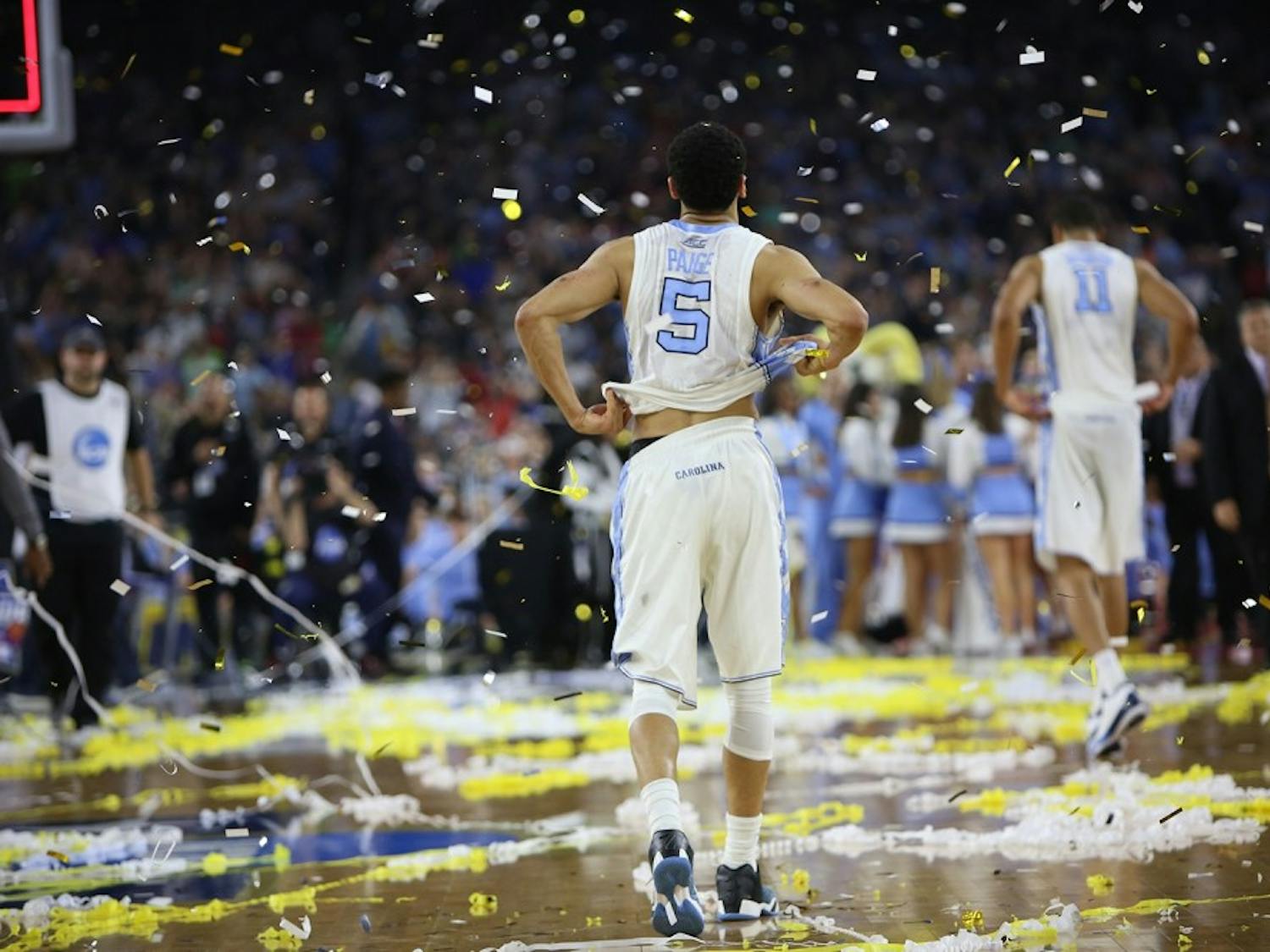 Then-senior guard Marcus Paige (5) walks off the court after UNC's buzzer-beating loss to Villanova in the 2016 national championship in Houston, Tex.