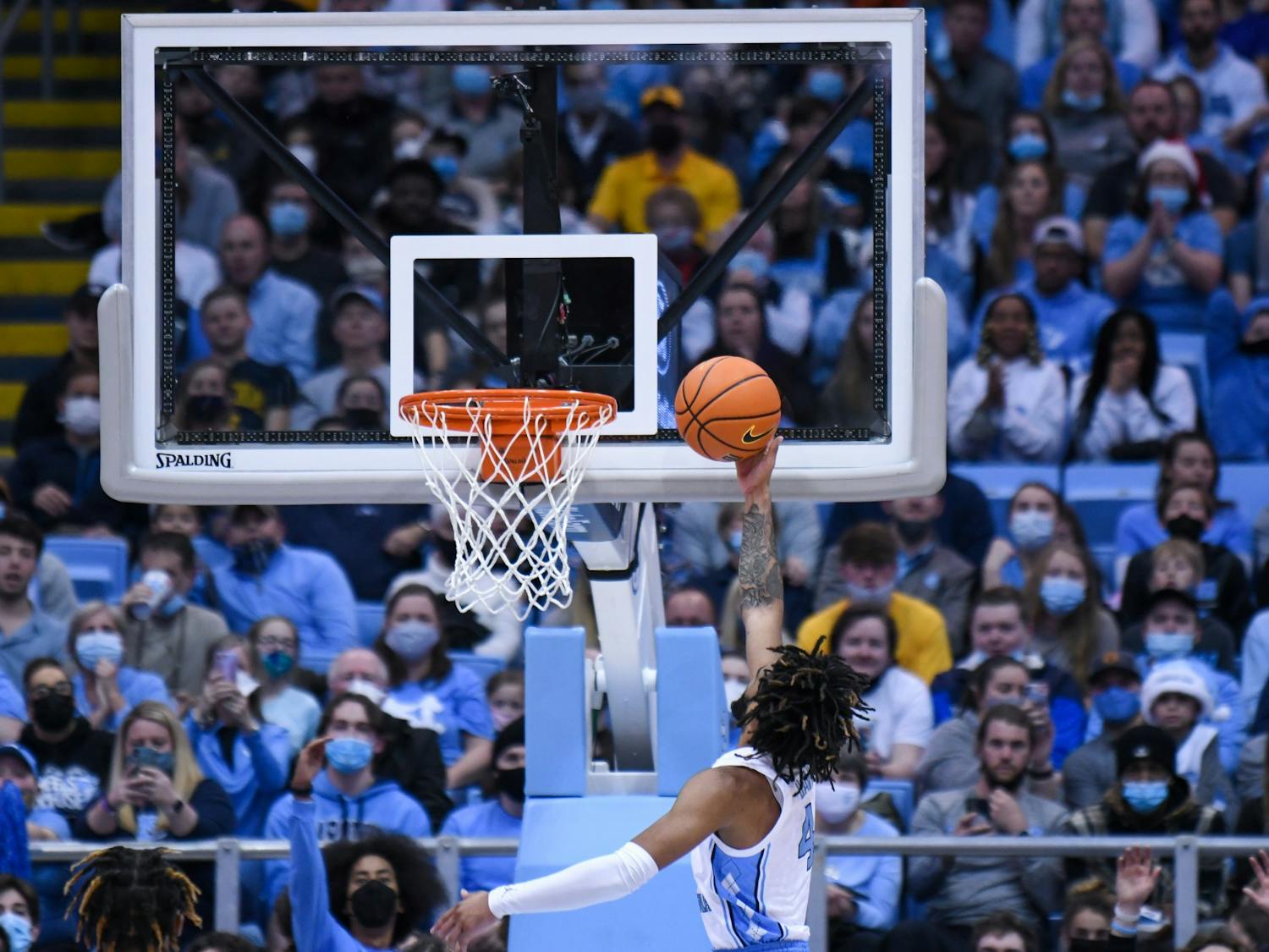 Sophomore guard RJ Davis (4) scores a point at the game against Appalachian State in the Dean E. Smith Center on Dec 21, 2021. UNC won 70-50.