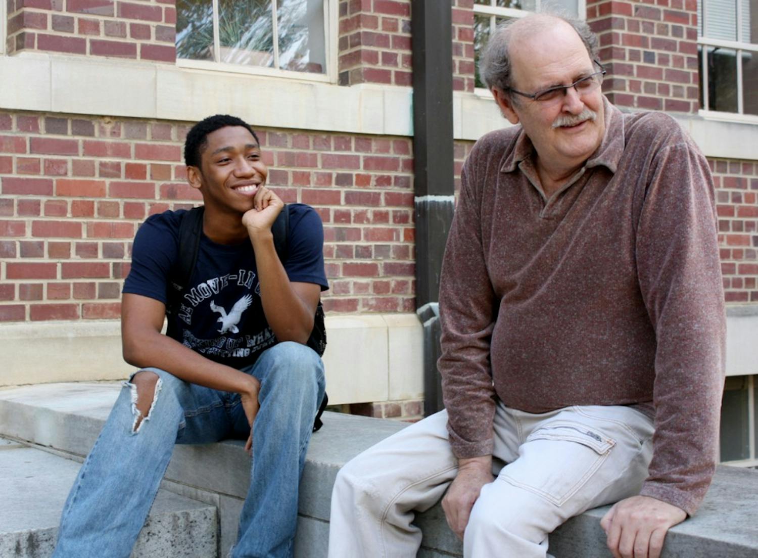 Ralph Byrns and his student Kahlil Blount, a sophomore political science and economics double major, talk outside Gardner Hall about class and starting an undergraduate economic research club. Blount said Byrns is “the best person in the economics department.”