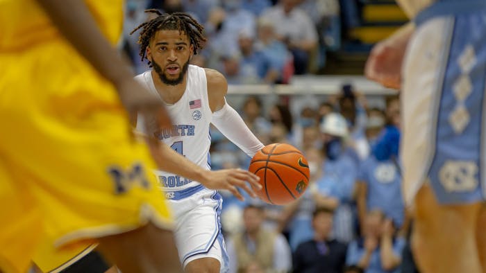Sophomore guard RJ Davis starts a posession during UNC basketball's home game against Michigan on Wednesday, Dec. 1, 2021.