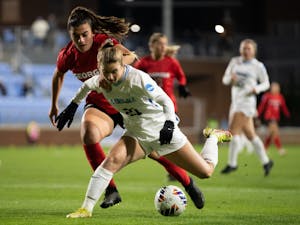 UNC redshirt first-year Ally Sentnor (21) protects the ball during the women's soccer game against Georgia on Thursday, Nov. 17, 2022, at Dorrance Field. UNC beat Georgia 3-1.